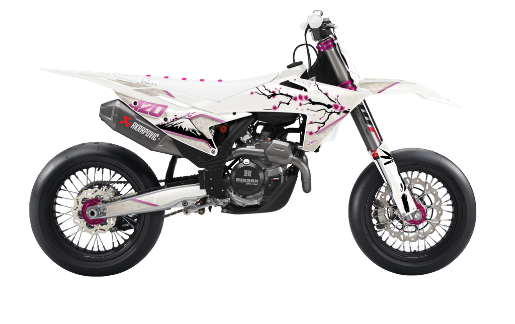 A white and black dirt bike with pink cherry blossom graphics, featuring a black exhaust and silver wheels, shown from a side profile on a white background.