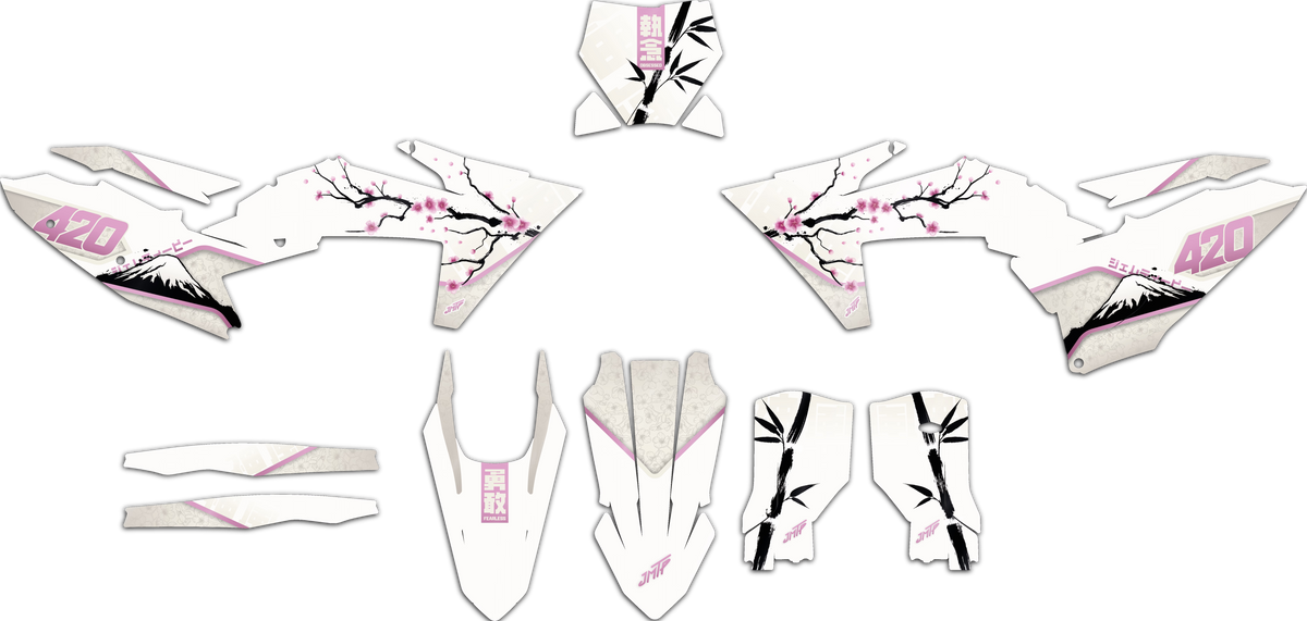 A set of white motocross or dirt bike body decals and graphics pieces with pink cherry blossom designs, black branches, and mountain graphics, laid out on a white background.