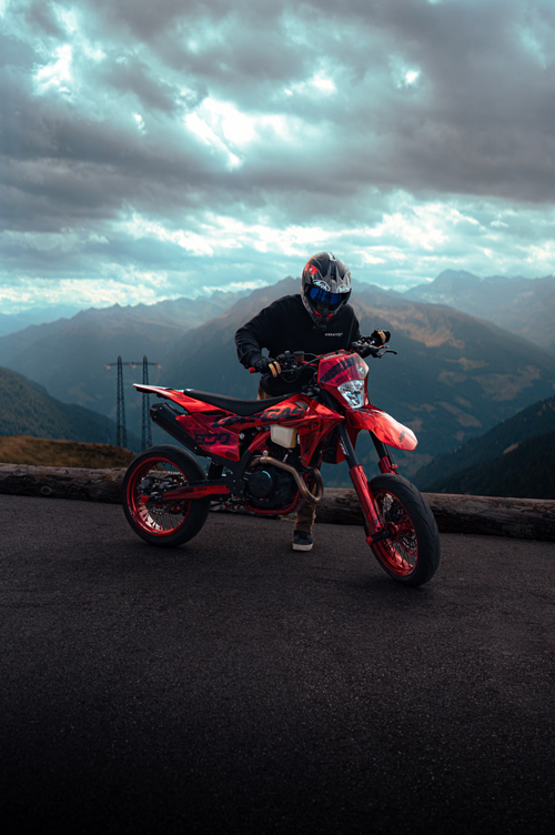 A red supermoto with smtp custom decals.